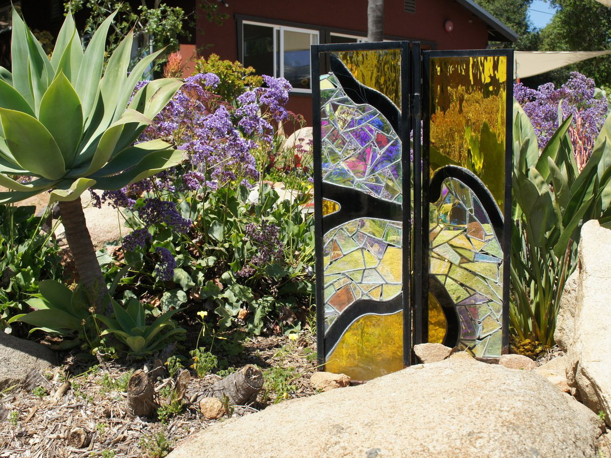 Glass art in mosaic rock garden