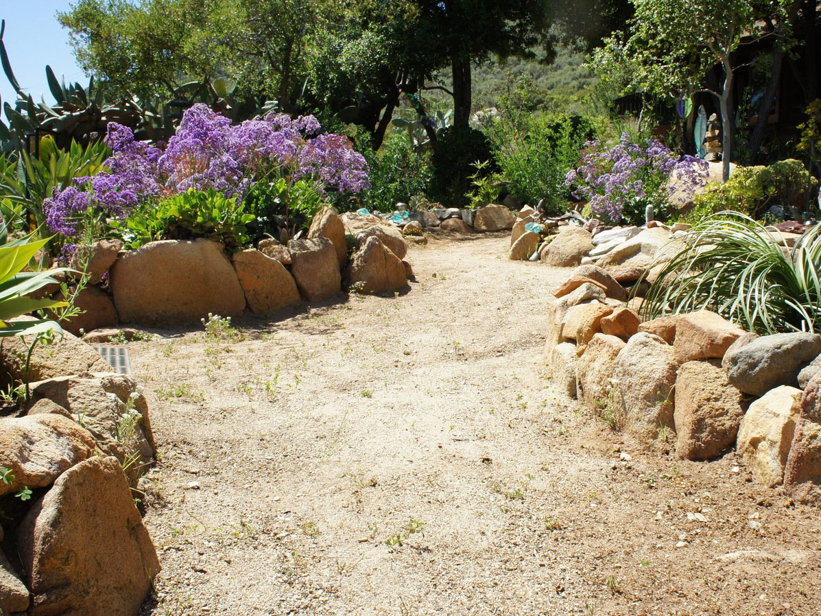 DG pathway with boulders in mosaic rock garden