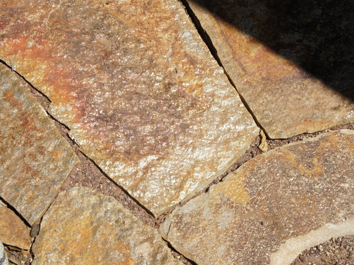 Flagstone patio in mosaic rock garden