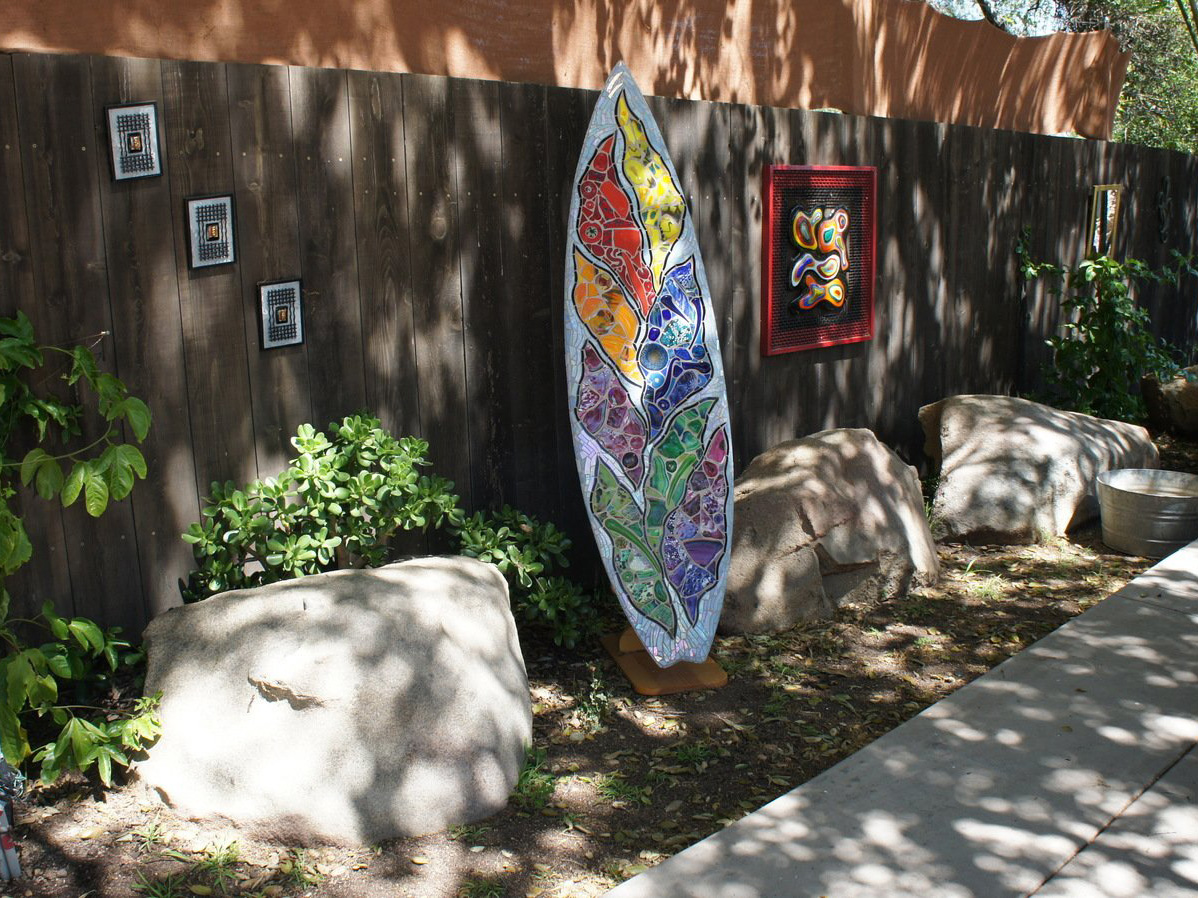 Mosaic rock garden art piece by boulders