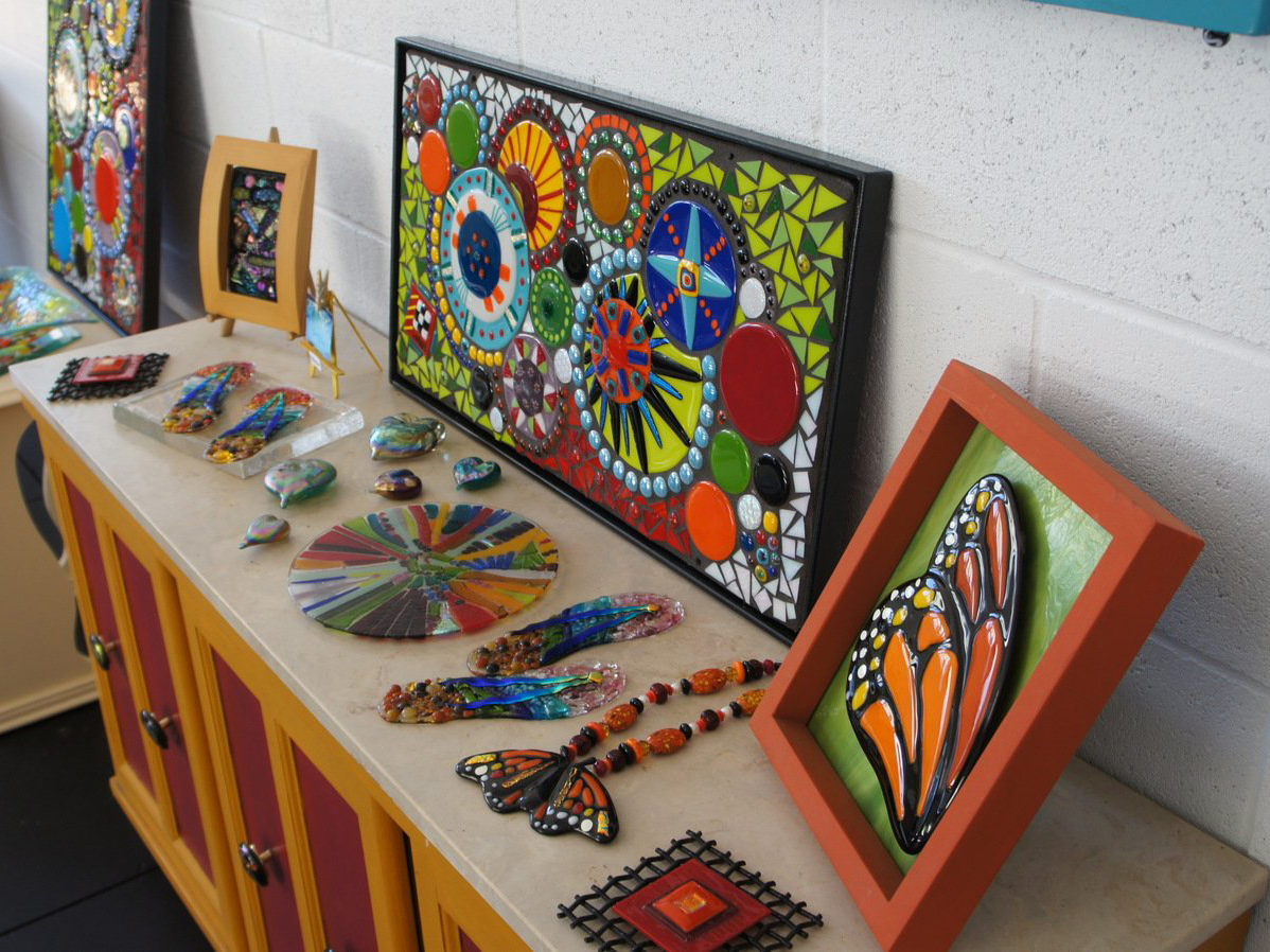 Mosaic rock art pieces on table