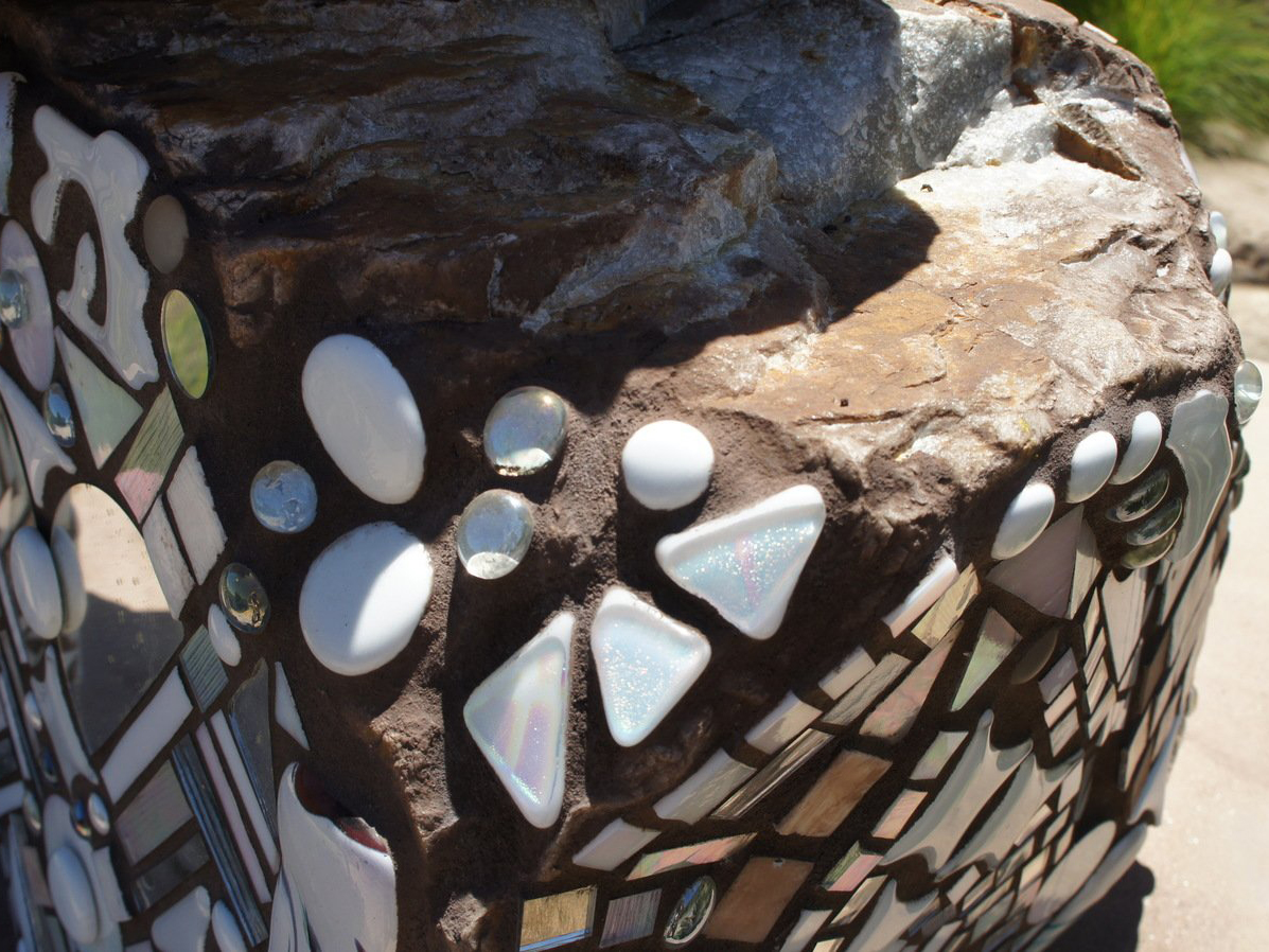 White glass on mosaic rock art piece