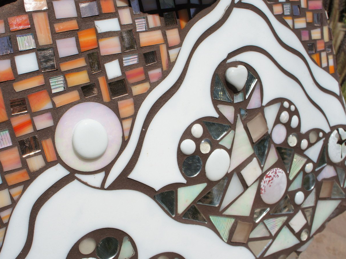 White and orange glass on mosiac rock art piece