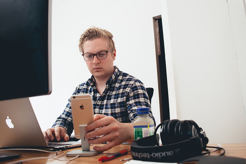 Devin Fountain checking his iPhone Devin Fountain checking his prototypes from his iPhone 6